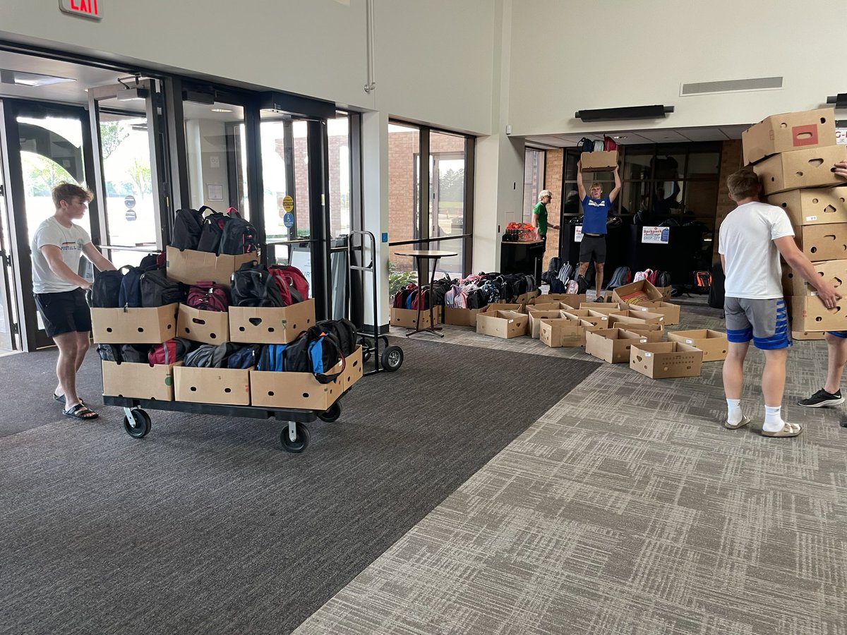 OG Football serve day with the Banquet Project S.O.S. Players boxing and loading 400 backpacks to be taken to the Banquet