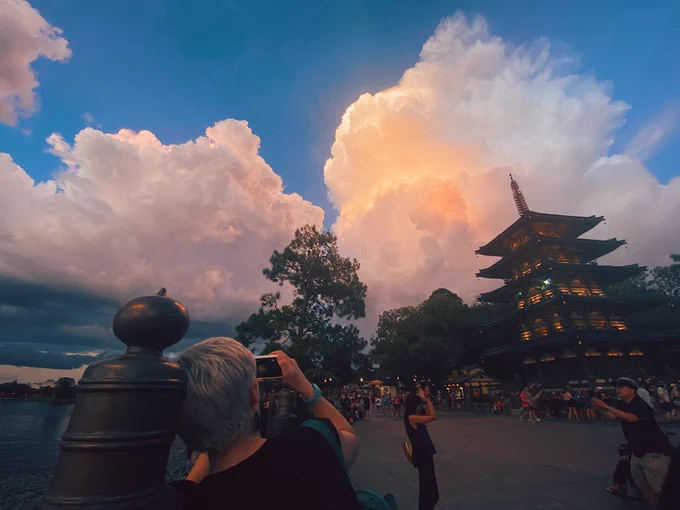 EPCOT for our 5th wedding anniversary, and after it bucketed down rain the clouds over the Japan Pavillion were all time AMAZING 