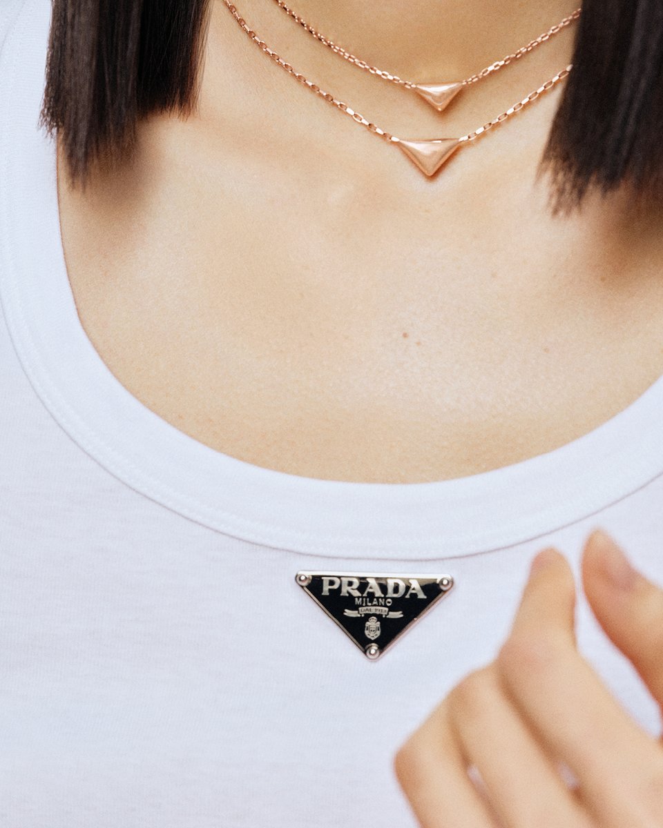 Prada's tweet photo. Prada triangle jewelry echoes the iconic original plaque that adorned early leather goods.
https://t.co/7Tw0nlUcD3.

#PradaFineJewelry
#Prada https://t.co/IRTrgJCMhS