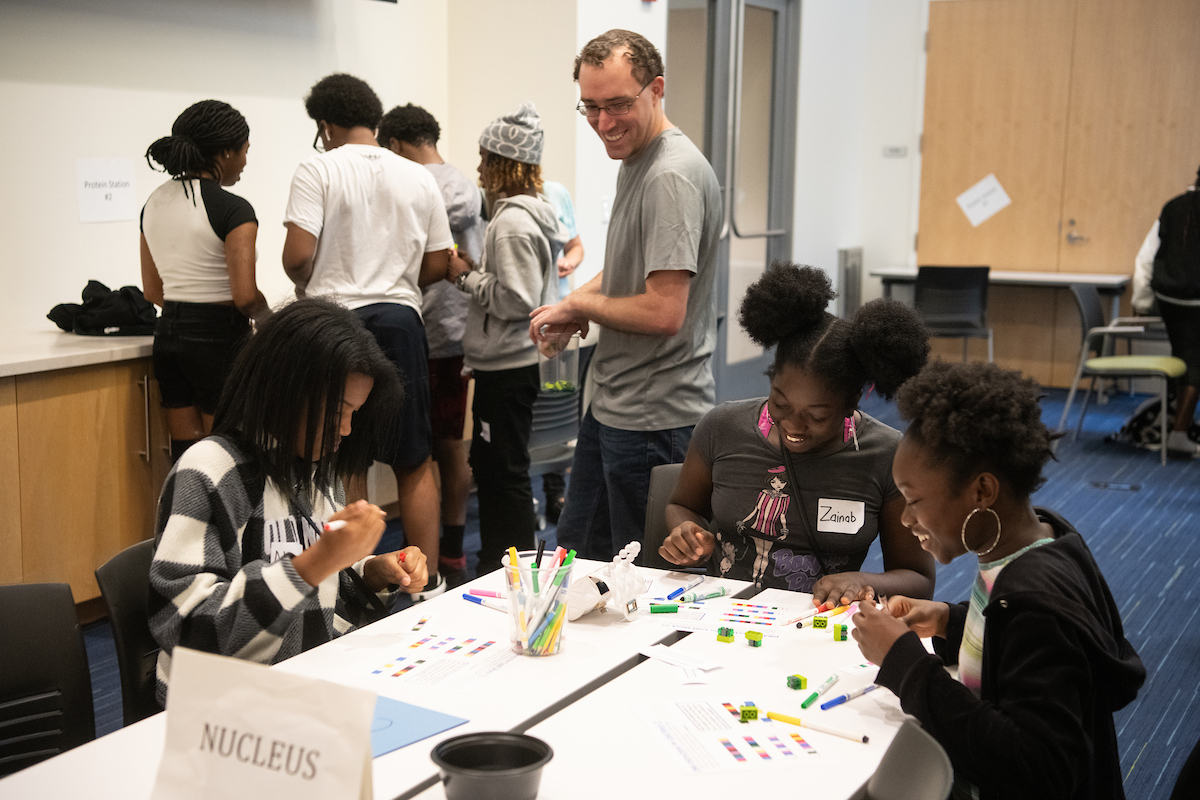 Photo of the Week: Middle school students from <a href="/UMB_CURE/">UMB CURE Scholars Program</a> Scholars Program learn about cell function during a learning workshop that included instructor Joe Receveur (center), a bioinformatics analyst at the <a href="/UMmedschool/">University of Maryland School of Medicine</a> <a href="/GenomeScience/">Institute for Genome Sciences</a> on July 20. #STEM #STEMeducation