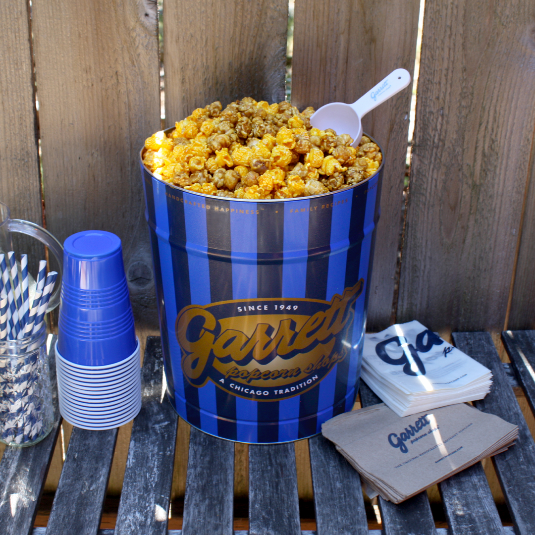 Summer is the season for outdoor celebrations! Get FREE ground shipping when you buy a Family, Friends, or Celebration tin! 💙 Add a free Party Kit with scoops, bags, and napkins. Shop now: bit.ly/3BgLnBQ #GarrettPopcorn *Available online only through 8/27