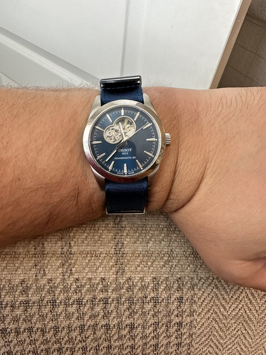 craigwatson1987's tweet image. Just got a @watchgecko NATO for my @TISSOT Gentleman Open Heart, and it’s stunning. Completely transforms the watch and complements the amazing blue on the dial. Love it!