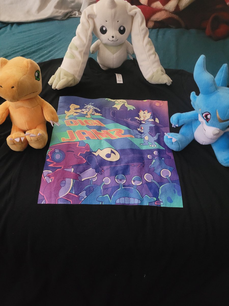 TrouzrSchnauzer's tweet photo. Exciting news ya'll! There's officially a Digi-Jamz T-shirt on my merch shop! It looks so badass!! This amazing artwork is by @desmormos 😁 If you wanna rep the Digi-Jamz swag, go check out the merch link below! ⬇️⬇️⬇️ #Digimon #DigimonMusic #DigimonWorld #DigiJamz #Merch https://t.co/2En0ixP5lB