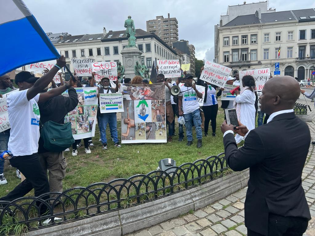 MountNSL's tweet photo. Sierra Leoneans in Brussels raise their voice for change! 🇸🇱📢 Protesting with powerful placards, they demand justice and a rerun of the June 24 election held in Sierra Leone. #SierraLeone #ElectionRerun #BrusselsProtest https://t.co/qCTXdVl0Sx