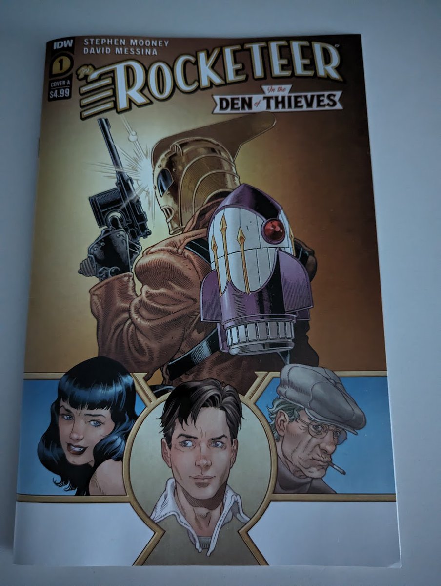 Jimmy's Review: #Rocketeer, #InTheDenofThieves. Issue 1. #StephenMooney, writer. #DavidMessina, artist. #Cliff's adventures in the 1940's(?)  Here #BettyPaige his lady is featured. Nazi bad guys capture the hero's friend who know about the Rocket details. (Pev?)