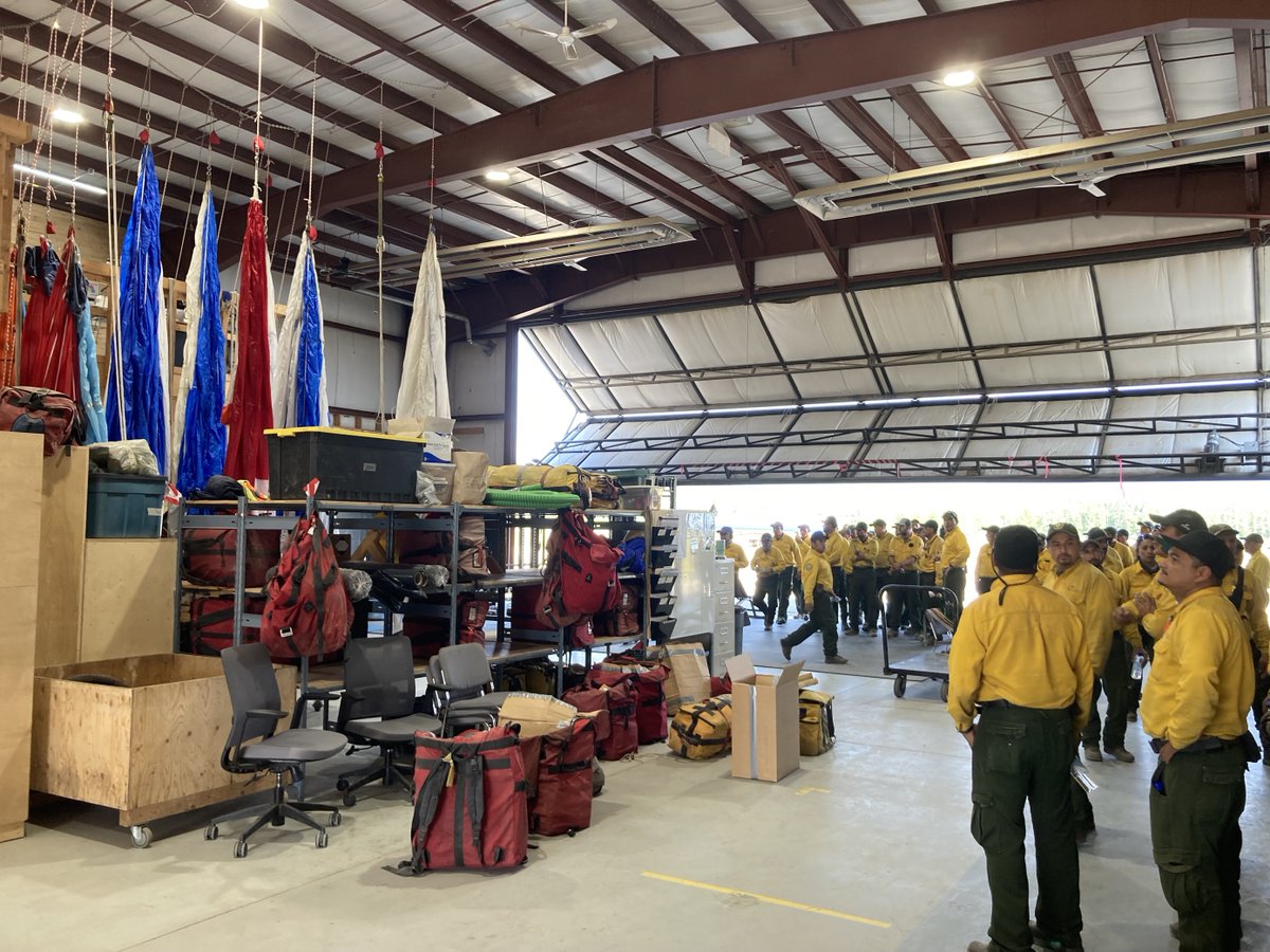 BLMFire's tweet photo. #ViewsFromWork: Ricardo Rubio, @BLMNational Great Basin Smokejumper has been working with a Mexican international crew as an interpreter & arranged a tour of the British Columbia base. Since May 8, the U.S. has mobilized a total of 2,051 #FirefightingResources to Canada. https://t.co/d8UXTlY5og