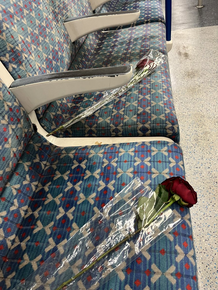 I think this is one kind strangers gift to another stranger/commuter. Planted on two different seats at the end of the Victoria line @TfL . A little dead now sure, but en route to the office @operahollandpk . Thank you mystery rose fairy… #sorryifistoleit #kindnessofstrangers