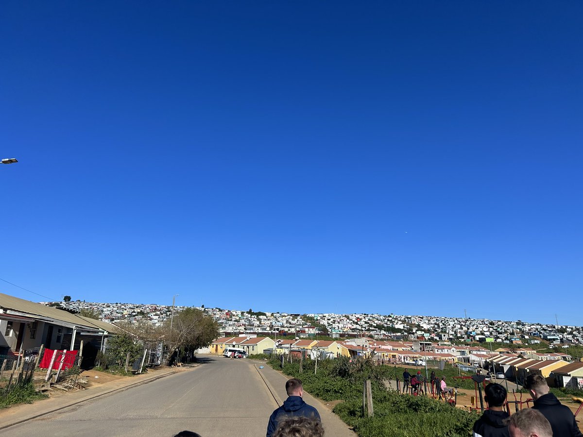 AoM_PE1's tweet photo. A truly eye opening experience this morning at the Kayamandi township, which is home to over 70,000 people. We visited a primary school which was followed by a drumming lesson and a traditional South African lunch. 🇿🇦@DT_AoMSchool @edwindoransport https://t.co/vYQJ92SD4v