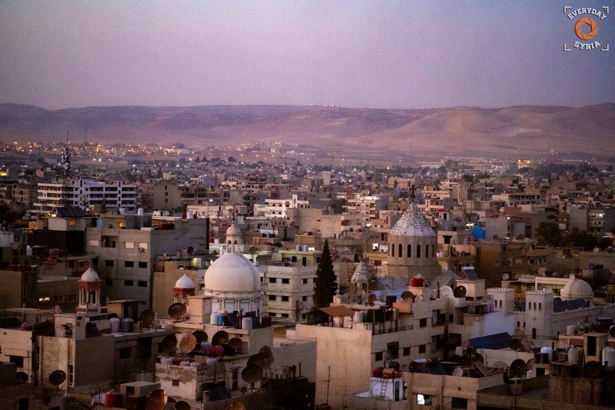 EverydaySyria's tweet photo. Photos of #Qamishli city, showing the tops of the city's churches and the lights and mountains of #Turkey in the background. https://t.co/HXvSxOhP1u