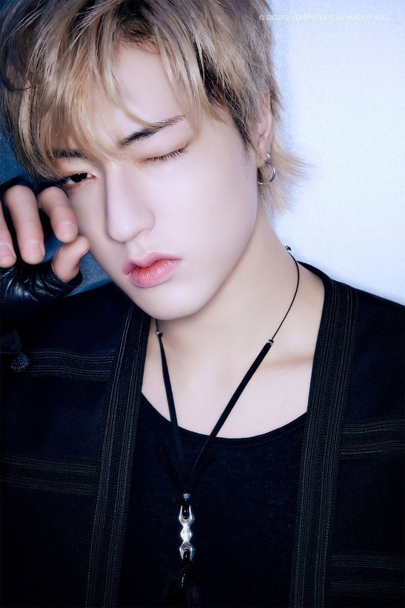 His black ensemble, impeccably tailored and seemingly imbued with an air of sophistication, enhances his already magnetic presence. The darkness that envelops him carries an air of intrigue, leaving whispers of untold stories and hidden depths in its wake.