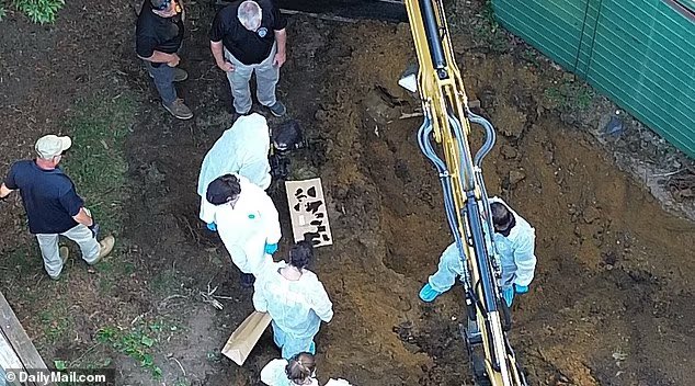 CoffindafferFBI's tweet photo. Photos from today at #RexHeuermann's home.

They are digging and finding more and more evidence. Tyvec suits, photographer snapping shots and the hole even deeper. 

His secrets were buried there. 

Notice the paper bags. These items are biodegradable. Thus, law enforcement will use paper bags, not plastic. 

They have unearthed so much evil.

#LISK 
#GilgoBeach 
#Gilgo4 
#Gilgo