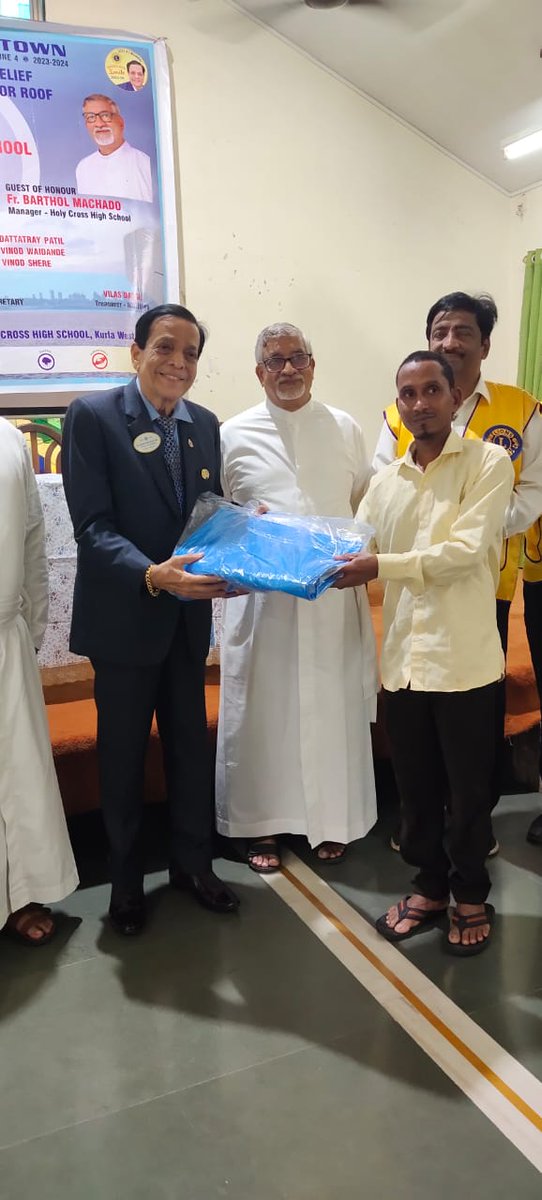 NorbertDsouza19's tweet photo. #LionsClub of #Midtown arranged distribution of  relief material for deserving families in the Kurla area at Holy Cross High School. #DrJaggannathraoHegde  , former Sheriff of Mumbai seen interacting with families at #HolyCrossHighSchool https://t.co/SLP1M7sjp5