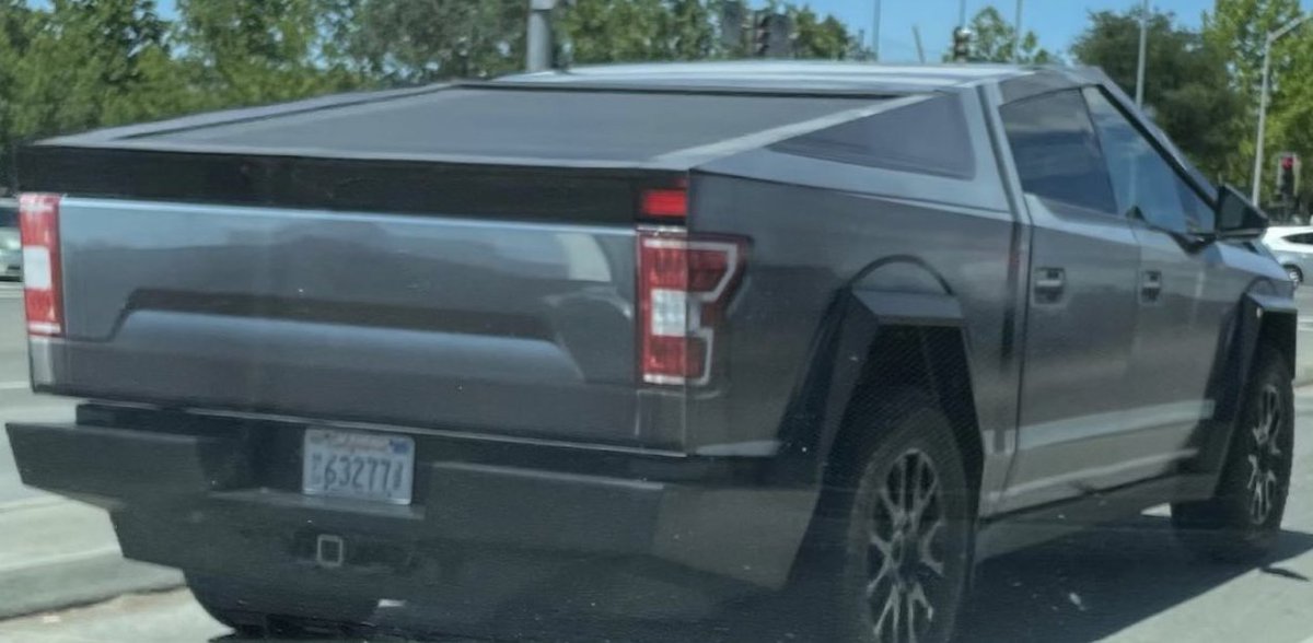SawyerMerritt's tweet photo. lMAO Tesla put a vinyl wrap in the design of a Ford F-150 on a couple of their Cybertrucks😂 https://t.co/3nNGtmwsWb