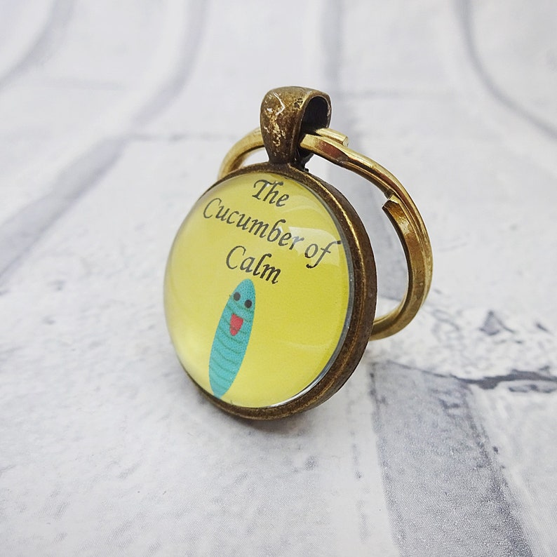 martisanne's tweet photo. The cucumber of calm will keep you cool as a cucumber all day https://t.co/Ze7xyrzaLc #SMILEtt23 #cucumberofcalm #coolasacucumber #cucumberfun #quirkykeychain #youbecool #keepcool #anxietyjewelry #funnykeyring #funjewelry https://t.co/lSWRYM5Sc6