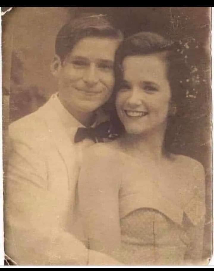 Please Help! I found this picture in the Aldi car park .
On the back it reads, “Mum and Dad, 1955”. 
I would love to return it to its owner.
Maybe if we all share it, we can find the owner.I think it may have been dropped by a young man in a silver car wearing a red body warmer.