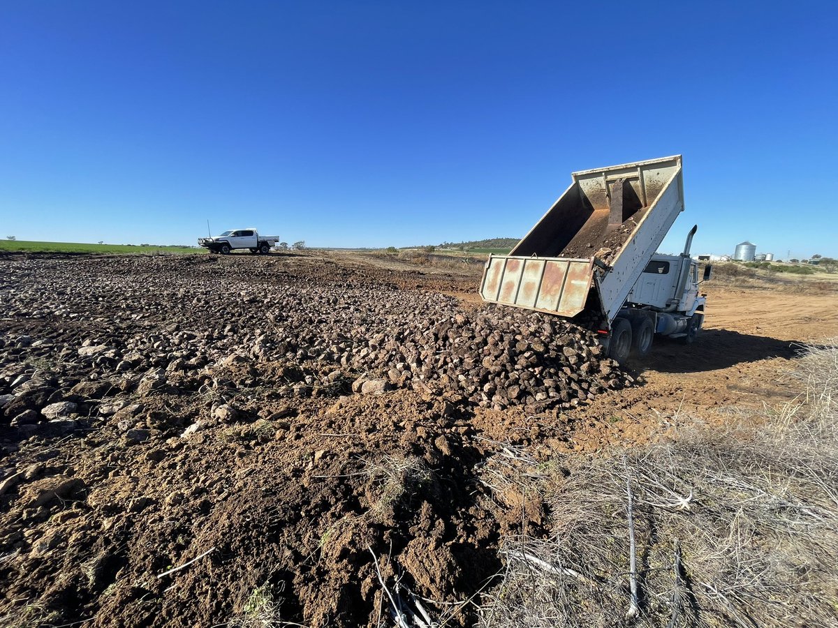 CroppaCo's tweet photo. Currently repairing damage to the dam overflow from the last 2 x floods. The gully cut over 7ft deep. Filling with rocks we’ve slowly picked over the years. #paddockmaintenance #farmsimple https://t.co/k8Fp9PAti8