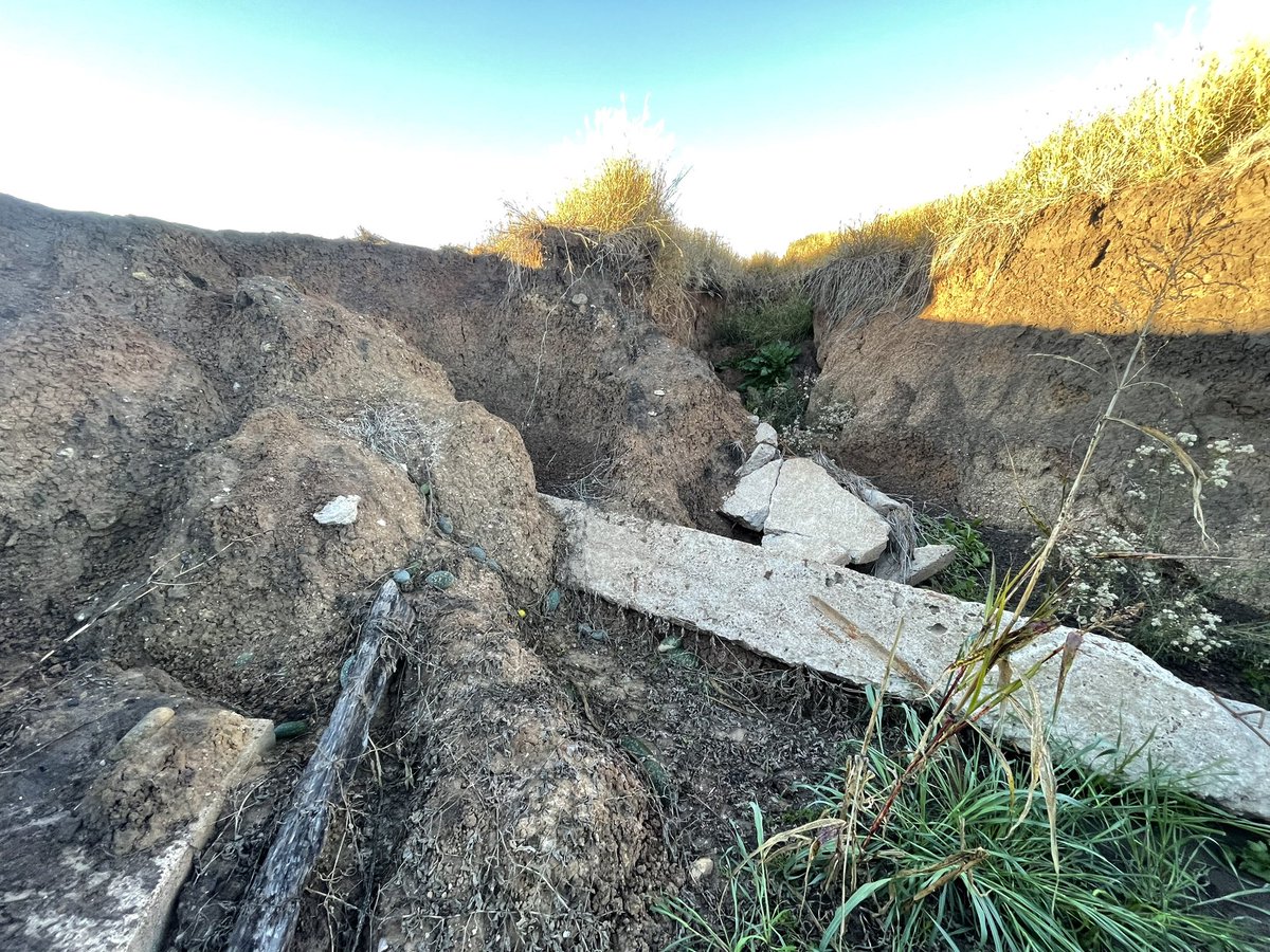 CroppaCo's tweet photo. Currently repairing damage to the dam overflow from the last 2 x floods. The gully cut over 7ft deep. Filling with rocks we’ve slowly picked over the years. #paddockmaintenance #farmsimple https://t.co/k8Fp9PAti8