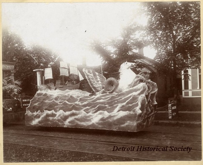 #OTD in 1901, a Floral Parade was held to celebrate Detroit's bicentennial. Mounted on a streetcar truck, the float pictured here shows a scene from Detroit's history labeled 'Navigation.'