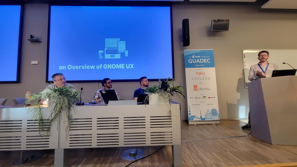 (Part of) the GNOME design team up on stage at guadec in Riga #guadec