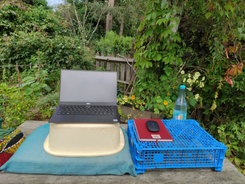 Today's standing desk. Upside down buckets, cardboard boxes and books have also worked well, depending on table height.