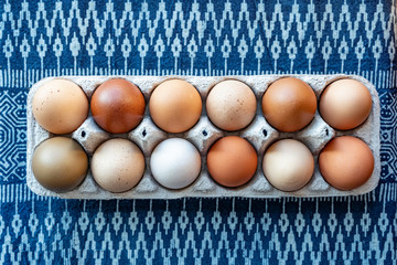 The nutrient breakdown of a large egg:  

Calories: 71 
Protein: 6.3 grams 
Fat: 4.8 grams 
Saturated Fat: 1.6 grams 
Monounsaturated Fat: 2.0 grams 
Polyunsaturated Fat: 0.7 grams 
Cholesterol: 186 milligrams 
Carbohydrates: 0.4 grams 
Fiber: 0 grams 
Sugars: 0.2 grams 
Vitamin