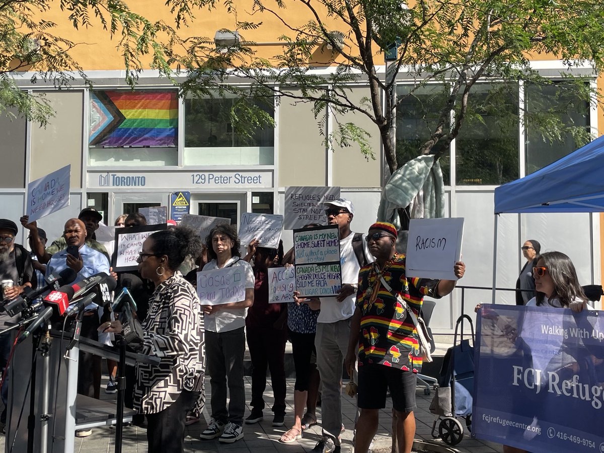AlexaNGilmour's tweet photo. At 129 Peter St for the Press Conference.  City at capacity.  Shelters full.  Hotels closing. Refugees sleeping in streets. Gov pointing fingers. This is supposed to be a sanctuary city. This is an emergency. We need urgent response. https://t.co/fC4cPrMFrJ