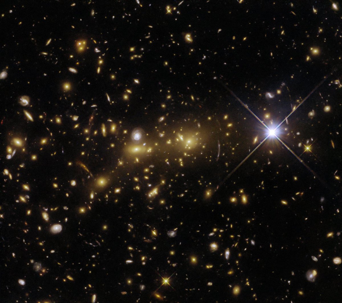 NASA_Marshall's tweet photo. A monstrous event is happening in the cosmos! 🧟 

@NASAHubble has captured a monster in the making. This collection of at least two galaxy clusters is merging to create a cosmic monster, a single enormous cluster acting as a gravitational lens.

MORE >> https://t.co/p0E2m5IAUT https://t.co/daIT6WlZAW