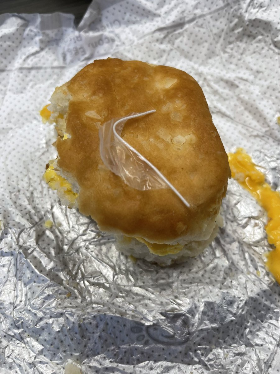 EmLueb's tweet photo. @ChickfilA gave me a piece of their trash vinyl prep gloves with my breakfast sandwich! 😍 and when i reached out to the direct location I was ignored! What a way to handle food contamination 🥲 don't go to the Tennessee St location yall!!! https://t.co/lI3g8dNIDG