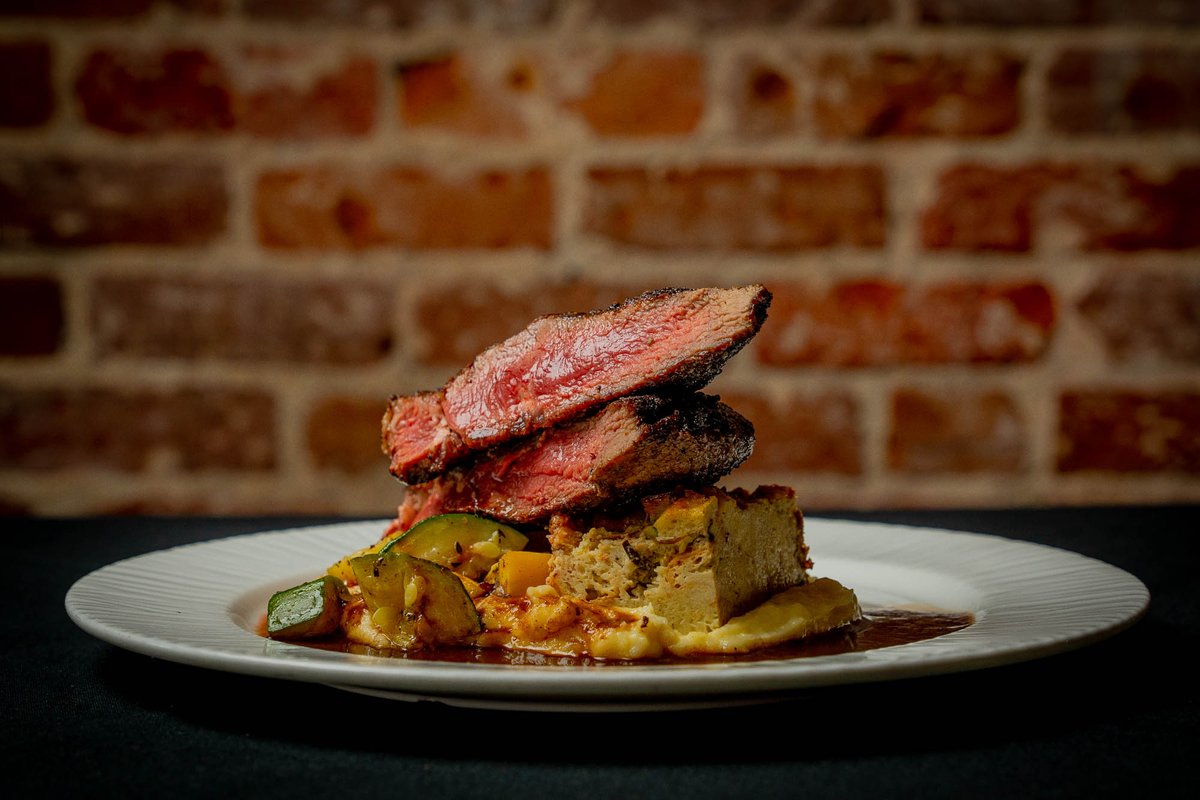 Herb Rubbed U.S.D.A. Prime Ribeye - How does this sound? Savory bread pudding, truffled yukon potato puree, roasted seasonal vegetables, with red wine and rosemary beef jus reduction! Come down and try it tonight! ...