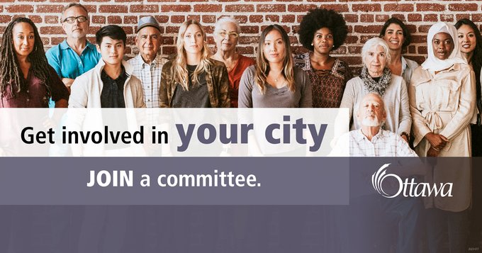 A diverse group of people are standing against a brick wall. In a white and purple text box reads: \