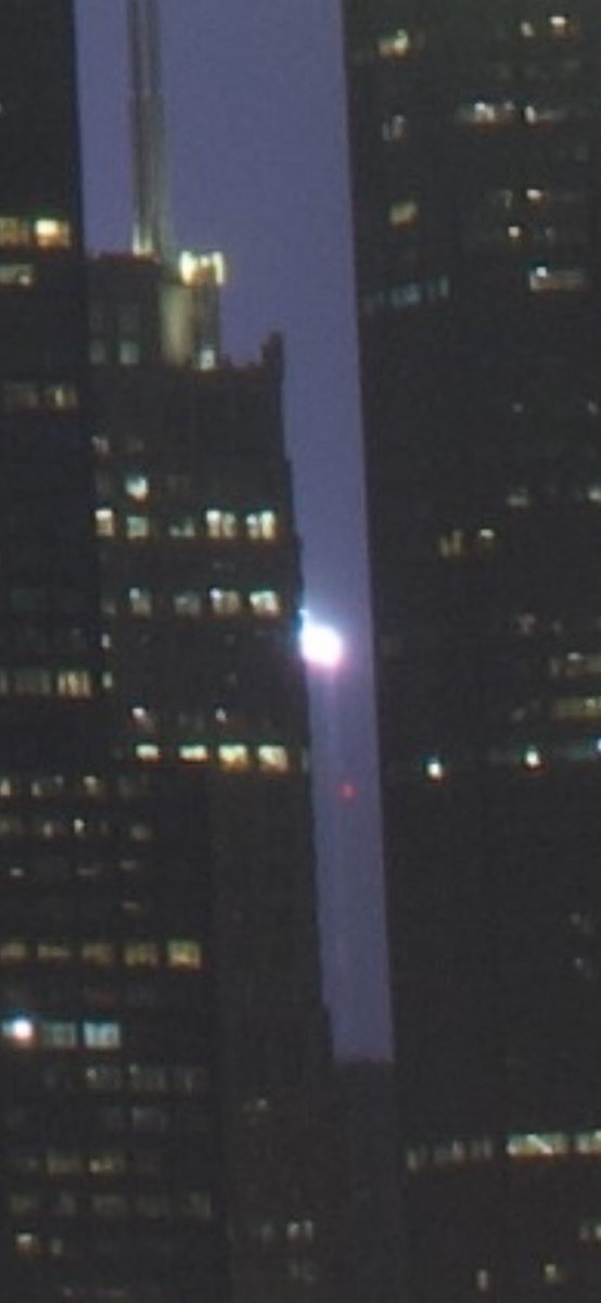 ChiPhotoGuy's tweet photo. At first I thought this bolt hit Skydeck’s ledge, but it actually hit Hancock’s antenna https://t.co/PXpnl667MG