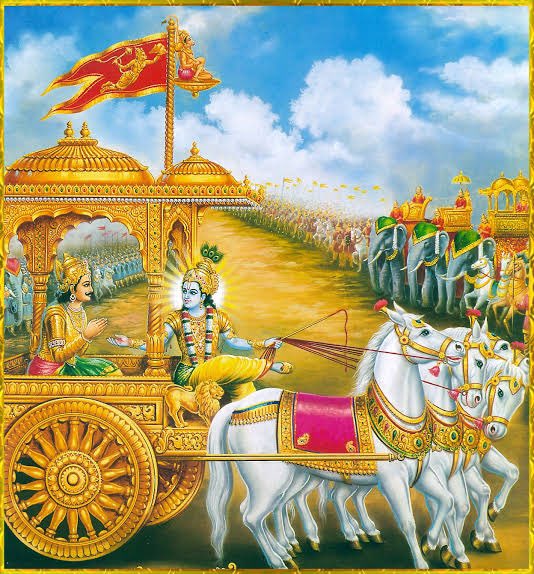 Why should Hanumanji be present on the flag when Lord Krishna himself was sitting on Arjuna's chariot as a charioteer?

Before the Kurukshetra war, Arjuna went to the Himalayas to offer prayers to Lord Shiva. On the way up He met Hanuman and during the conversation, Arjuna wanted