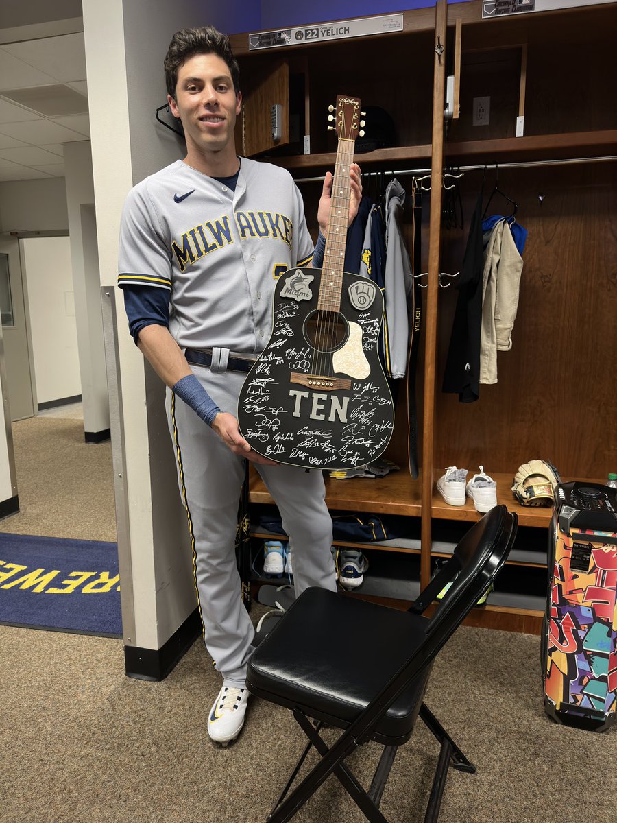 Brewers's tweet photo. Christian Yelich celebrated 10 years in the majors during the All-Star break! 

Today, the team surprised him with an autographed guitar signed by all the players and coaching staff.

Congrats, Yeli! 🎸

#ThisIsMyCrew I @ChristianYelich https://t.co/lJO3I2Tqsv