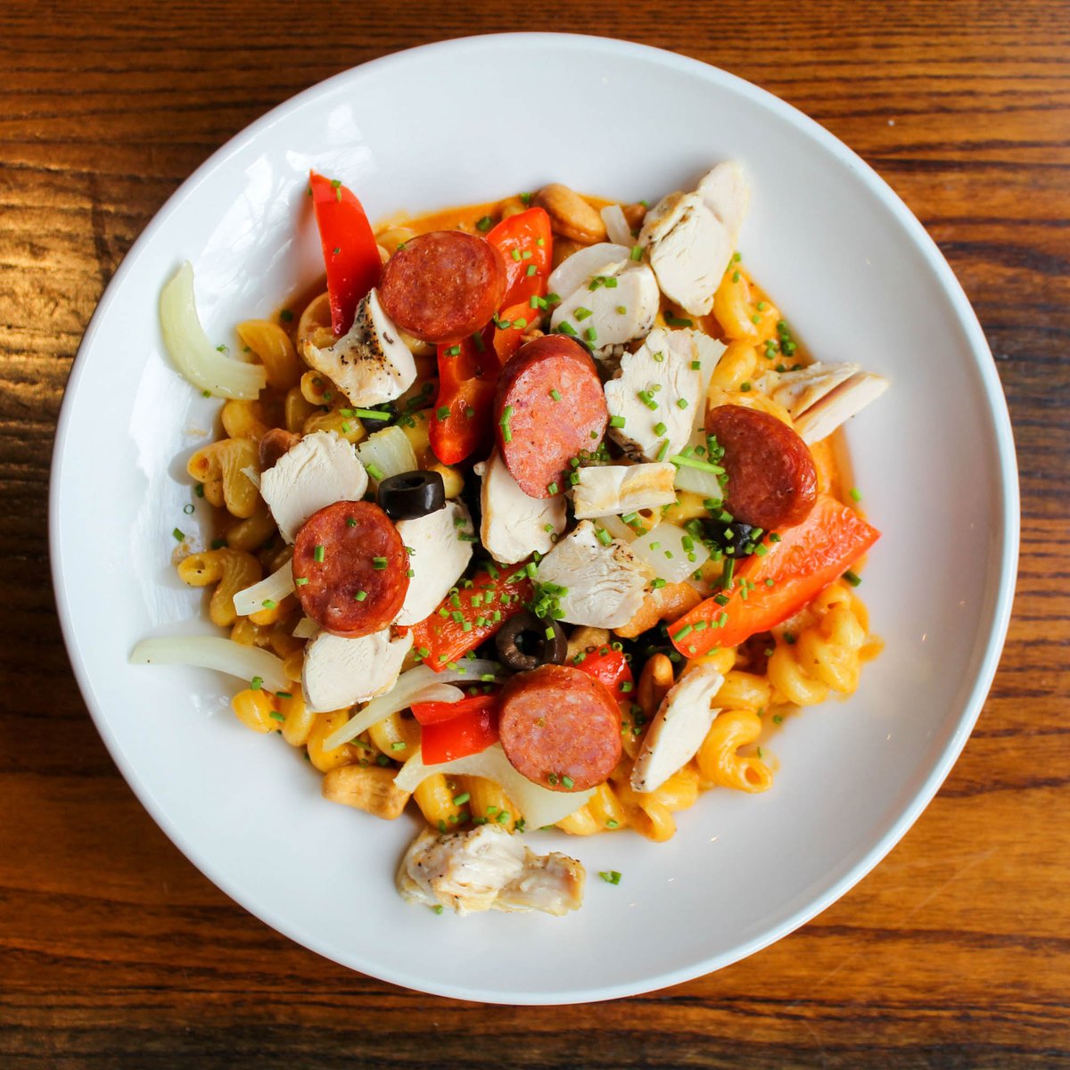414Thebay's tweet photo. The Mustache Twirler Chicken Pasta. Cavatappi pasta with red peppers, green peppers, cashews, onions, andouille sausage, black olives &amp; chicken in a zesty Cajun cream sauce. Served with Garlic Bread https://t.co/W0UXcdepsk