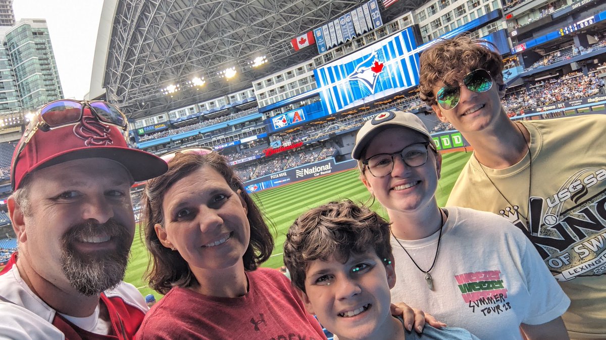 Chris_Bussell's tweet photo. The family is certainly enjoying our first #BlueJays game and DJ Steph Honey is amazing, but.... We miss the @bravesorganist Matthew Kaminski and his witty musical puns at Truist Park #GoBraves https://t.co/LOXkJfM4r5