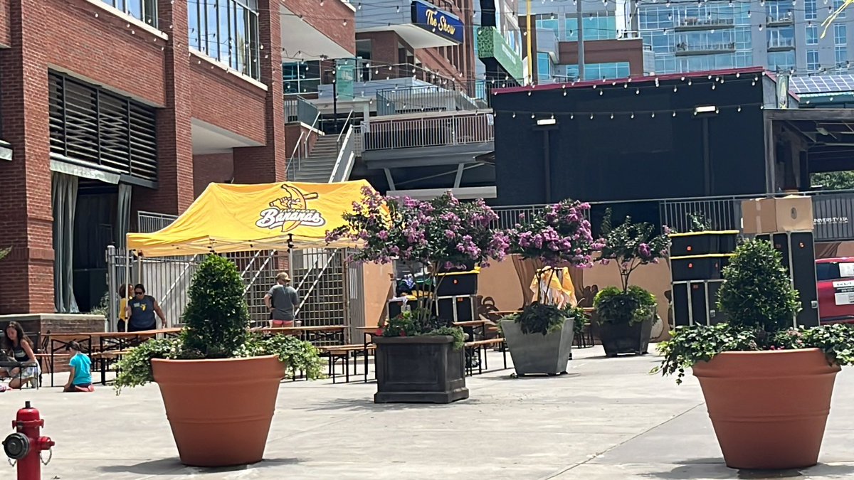 FoodDriveLady's tweet photo. Merch stand! Yaaas been waiting to get our merch when the fam and I came to our first game. Yellow isn’t my usual color, but today it will be! @TheSavBananas #savannahbananalineleader https://t.co/w3JxAo5c7a