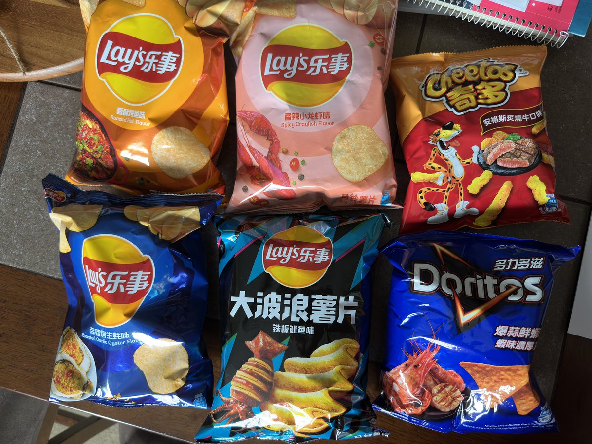 Railvas's tweet image. Last nights chip haul from our anniversary outing in Providence. There’s roasted fish, spicy, crayfish, squid, roasted garlic, oyster lays potato chips, steak, Cheetos, and prawn flavored Doritos. What should I try first? Leave a comment and let me know!
