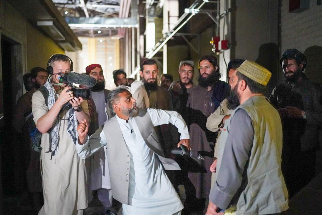 Moazzam_Begg's tweet photo. Images from my return trip to #Bagram #Afganistan

I’m describing how prisoners were hooded and their hands shackled above their heads to the cage door and punched and kicked. 

I’m explaining how an Afghan taxi driver by the name of Dilawar was beaten to death after being tied up like this for days and that image has been engraved in my head ever since.

I’m explaining how US soldiers would throw Qurans over cell doors when prisoners asked for them or drop kick the book like a football. When we first arrived soldiers ripped the Quran into pieces and threw them into buckets of excrement.

An American Egyptian interrogator told the US soldiers not to allow us to call the athan, recite the Quran or pray in congregation because that allowed to communicate with one another. If anyone did, they’d be tied up - just like Dilawar.

We had two small bottles of water per day. If we used them to wash or make wudhu we’d have nothing to drink. So most made tayammum. I did so for a year and forgot the correct sequence of wudhu by the time I arrived in #Guantanamo.

Despite this, I’m also telling them how I managed to memorise Surah Al-Baqarah - the largest chapter of the Quran - in this very spot. 

Im explaining how they’d built tiny one square metre isolation cells and kept us there for days on end during interrogation periods. 

I’m telling them about the screams of the woman I used to hear I thought was my wife; and how news of the birth of my son reached me here. 

Im retelling them how I saw all of this in a  vivid dreamI had 8 years before I came to Bagram.

I’m describing how British intelligence agents - who’d questioned me in UK several years before - came here many times and interrogated me while prisoners were screaming and tortured to death. 

Other than Guantanamo, I lived in this place away from home longer than anywhere else, so I knew it very well. 

This place is now abandoned and very dark - both physically and metaphorically. 

Returning here was an indescribable experience. I couldn’t help but to breakdown when recounting my thoughts and memories.

It’s no longer a torture facility but I did ask that IEA preserve some part of the place so that it’s never forgotten. They said they intend to do so but also they’d like to make it into a centre of learning, where young people can study for the future without forgetting the darkness of the past.

*Deepest gratitude to #Afghan former Bagram and #Gitmo  prisoners, families and very helpful #IEA officials for helping to make this happen. Images courtesy of @ShnizaiM. 

The film should be out in a few months  @AJEnglish #Witness in sha Allah. 

May Allah accept the efforts and sacrifices of all involved. 

الحمد لله حمدا كثيرا طيبًا مباركا