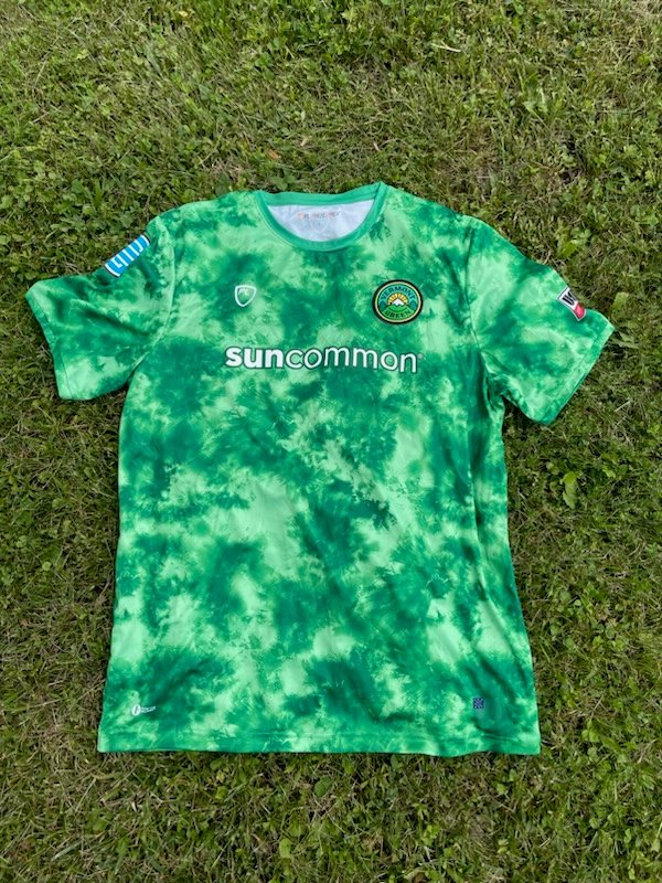 UVMathletics's tweet photo. Our official jersey auction for flood relief with @32auctions now includes exclusive 2022 game worn jerseys from @VermontGreenFC! 

Bid now at https://t.co/4yTUMeWLDA, all proceeds go to the @UnitedWayNWVT "United Flood Relief Fund."
#VTFlood2023 https://t.co/GRAKQeABDw