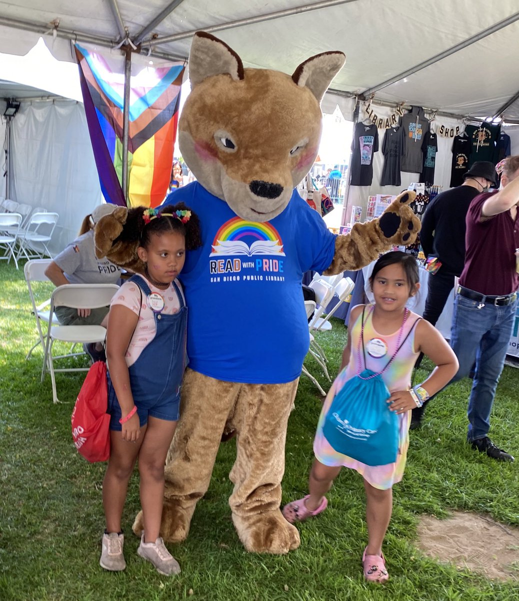 #OdiTheCoyote is at the <a href="/SanDiegoPride/">San Diego Pride</a> Festival, too! Check them out making some new friends at the Lit Café! 🧡 We’re holding events and activities all day in this section! sandiego.librarymarket.com/event/lit-cafe…