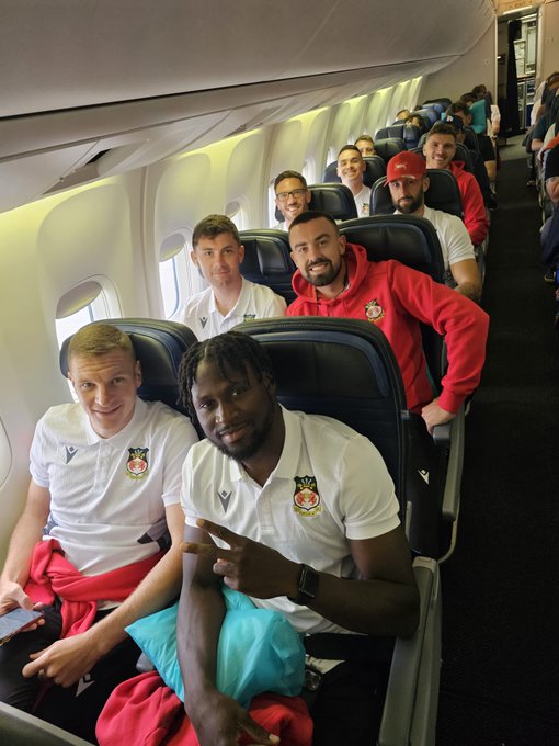 Wrexham players in their seats on their United Airlines flight