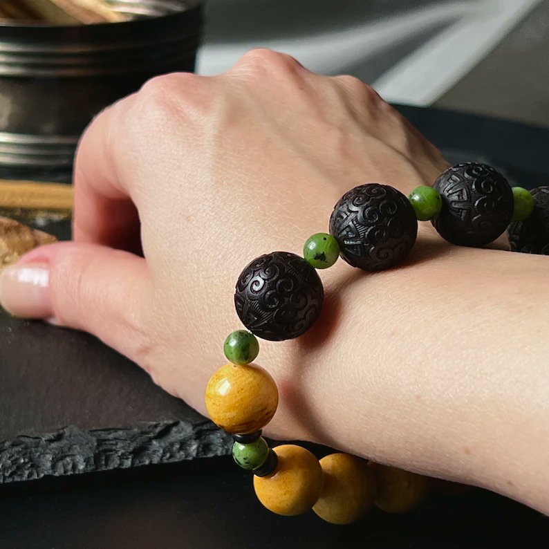 Natural Amber, Jadeite, and Ebony Bracelet, perfect for Boho Style lovers and holistic living enthusiasts! 🌿✨ Embrace the beauty of nature with this stunning accessory. #HandmadeJewelry #NaturalAmber #Jadeite #EbonyBracelet #BohoStyle #HolisticLiving etsy.com/listing/144325…