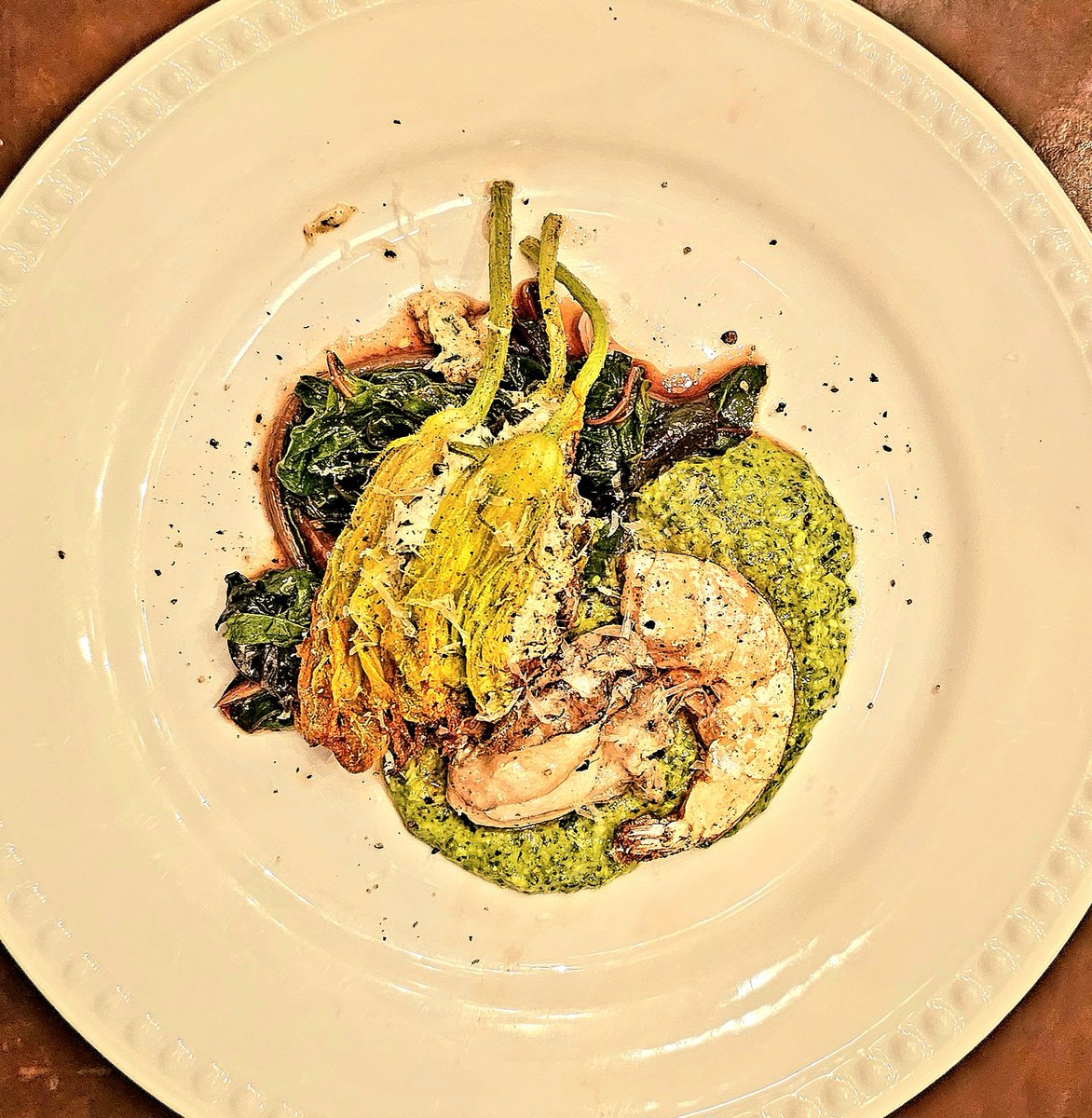 IndigenousImmi1's tweet photo. Lemon, herb ricotta-stuffed squash blossom on rhubarb balsamic vinaigrette chard with fried oysters and shrimp. Purslane pesto to round out the plate. https://t.co/oq4s9cGqBp