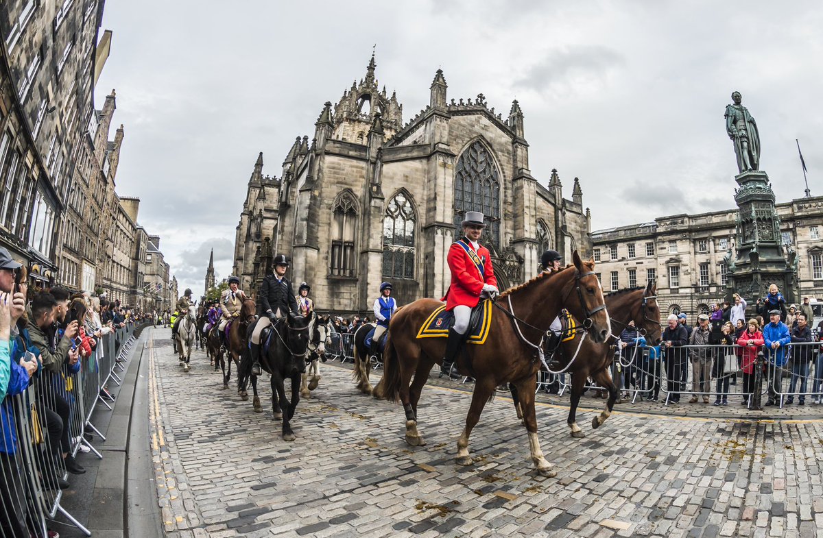 Photo from 2018 Edinburgh Riding of the Marches, with distinctive red jacket of 2018 Annan Cornet, Blair! Every Riding Town in Scotland has a uniform for Principal Riders (elected representatives/Standard-bearers), paired with a sash bearing the town’s coat of arms. 📸 Phunkt