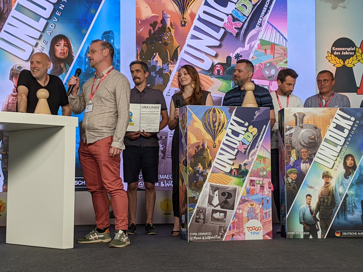 SpieldesJahres's tweet photo. Wir verleihen einen gemeinsamen Sonderpreis an Unlock! Game Adventures von Cyril Demaegd, Mathieu Casnin, Thomas Cauët und Jeremy Koch und Unlock! Kids: Detektivgeschichten von Cyril Demaegd, Marie Fort und Wilfried Fort (Space Cow). #SdJ23 https://t.co/4oORx8e7l3