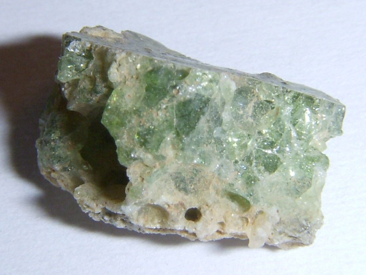 Trinity atomic bomb test has obliterated the metal tower, leaving a radioactive crater of green glass. Resulting "trinitite" is made of New Mexico desert sands fused by nuclear fire.