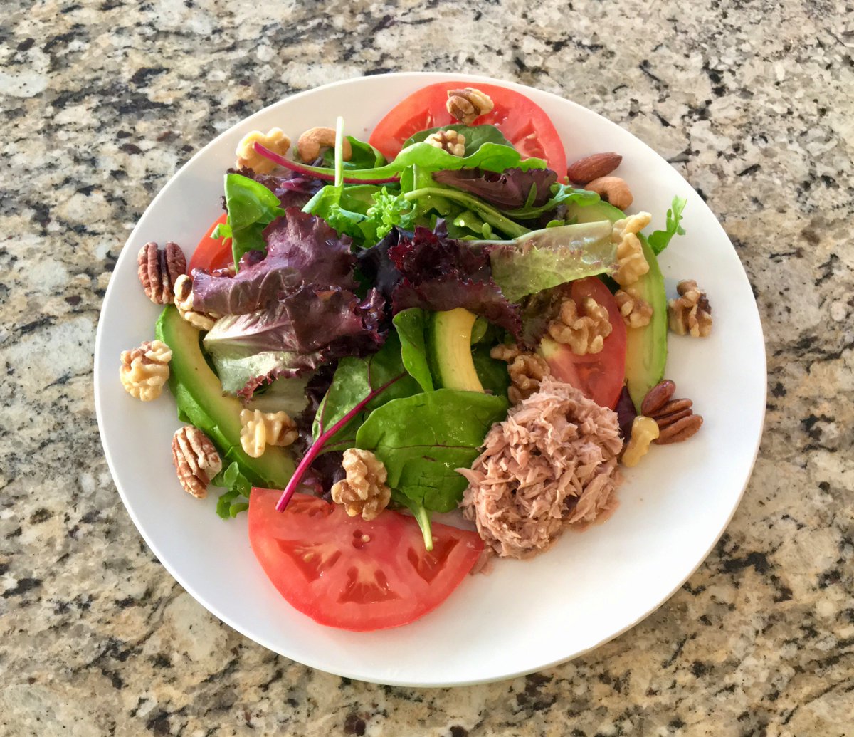 Tonight, I put together a mixed greens salad with avocado, tomato, nuts, and a side of tuna, topped with extra virgin olive oil. Enjoyed with a glass of 2019 Bocelli Toscana Sangiovese. 🍷

#MediterraneanDiet