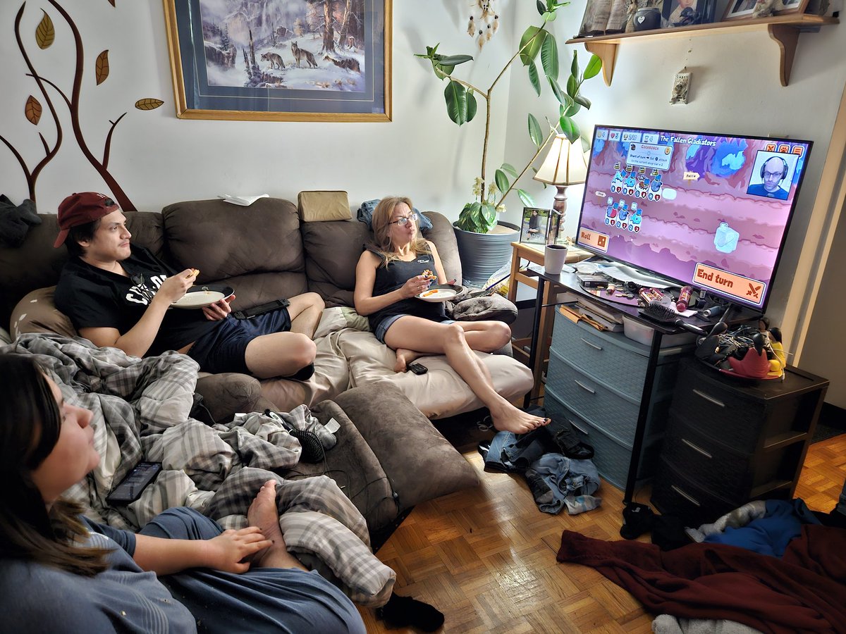 Found my family watching northernlion play super auto pets on the living room TV