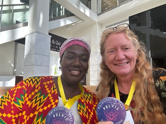 Happy here at @WomenDeliver! I met @RukayaMumuni who is a FGS Scholar with @DigitalScholarX showing our Parasites in your Pelvis buttons raising awareness about FGS. I look forward to attending the @womenGH #HeroinesOfHealth Awards ceremony with her. @ASTMH @TFGH @TheENDFund