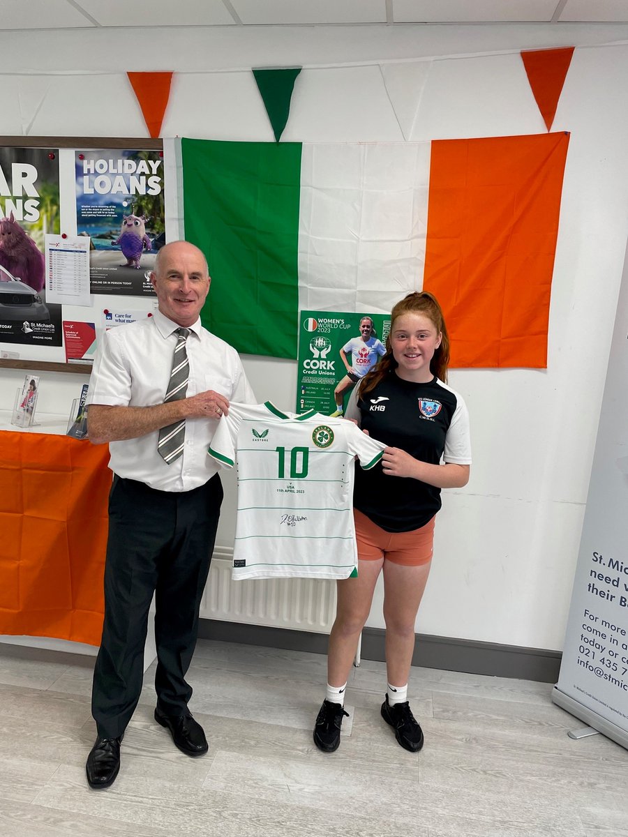 CorkCUs's tweet photo. Deborah Brett and her daughter Kaycee popped in to @St_Michaels_CU to collect her match worn and signed @OSullivanDenise  Jersey from Sean Lucey (Staff) 
Kaycee could be a future Cork football star having Vice-captained her team in the #CWSSL U12 22/23 season!
#CorkCUs #COYGIG https://t.co/eMEKTpRQDu